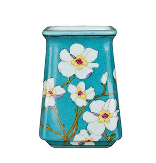 Green vase with white flowers