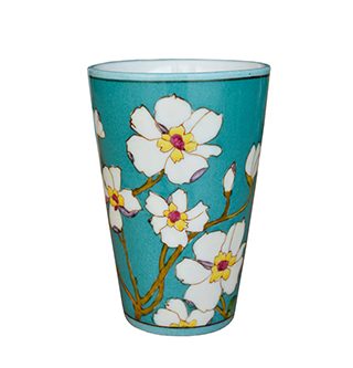 Green cup with white bunch flowers